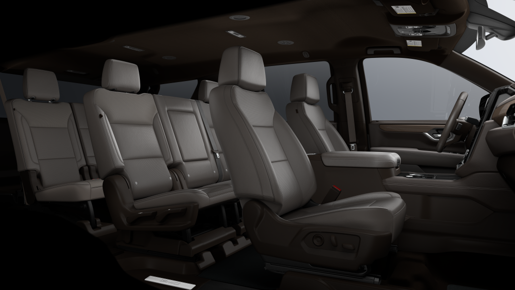 Interior of 2026 GMC Yukon XL Elevation showing three-row seating with leather-appointed seats, spacious cabin layout, and second-row bench configuration