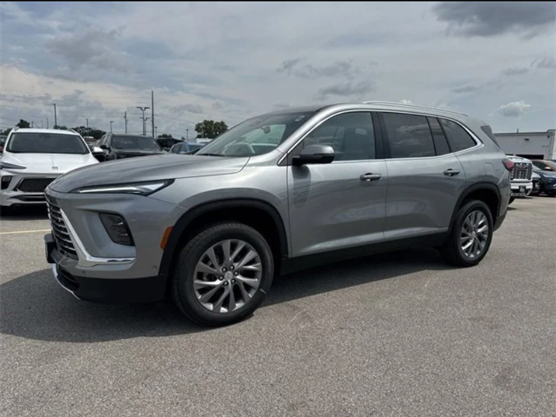 2026 Buick Enclave Preferred in Moonstone Gray Metallic shown on the lot at Dave Sinclair Buick GMC in St. Louis, a three-row midsize SUV.