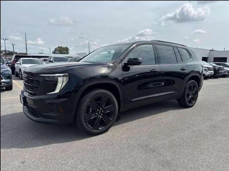 2026 GMC Acadia Elevation in Ebony Twilight Metallic parked at Dave Sinclair Buick GMC in St. Louis with black wheels and modern SUV styling.