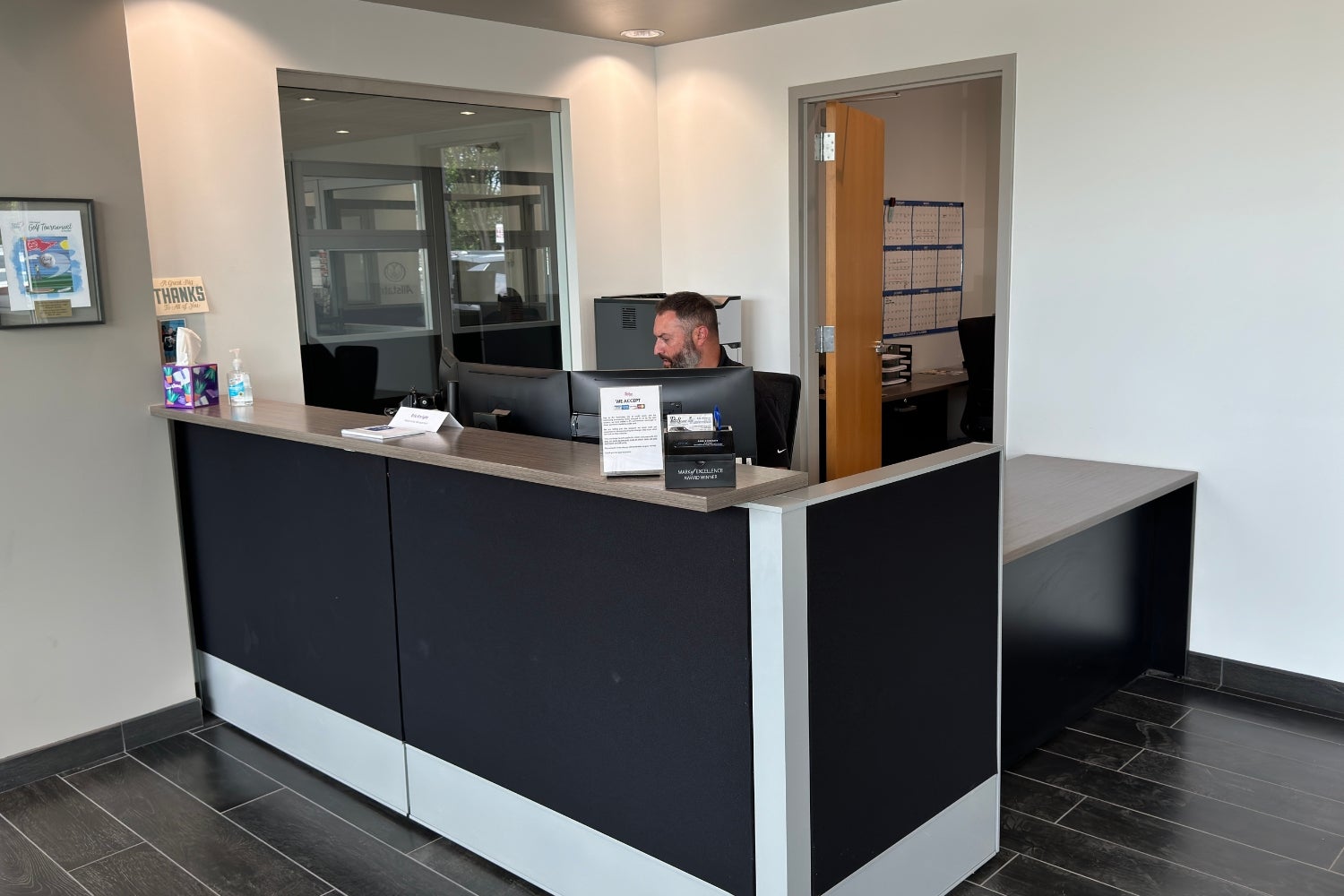 Collision center estimator at the customer service desk at Dave Sinclair Buick GMC