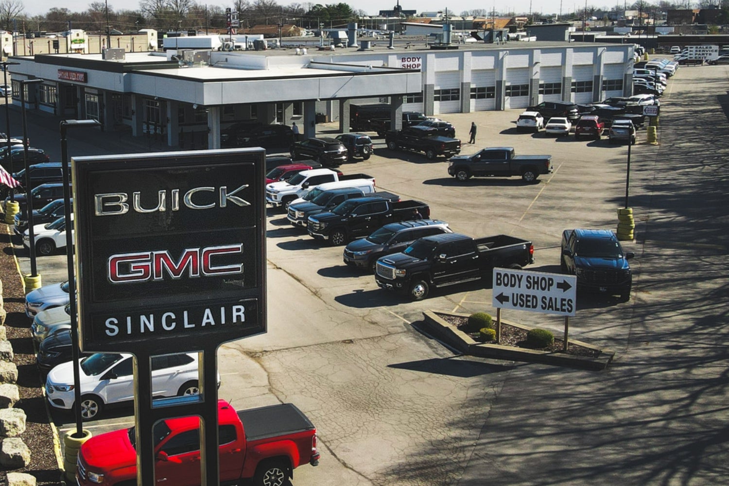 Dave Sinclair Buick GMC sign near the collision center entrance on Tesson Ferry Road in St. Louis
