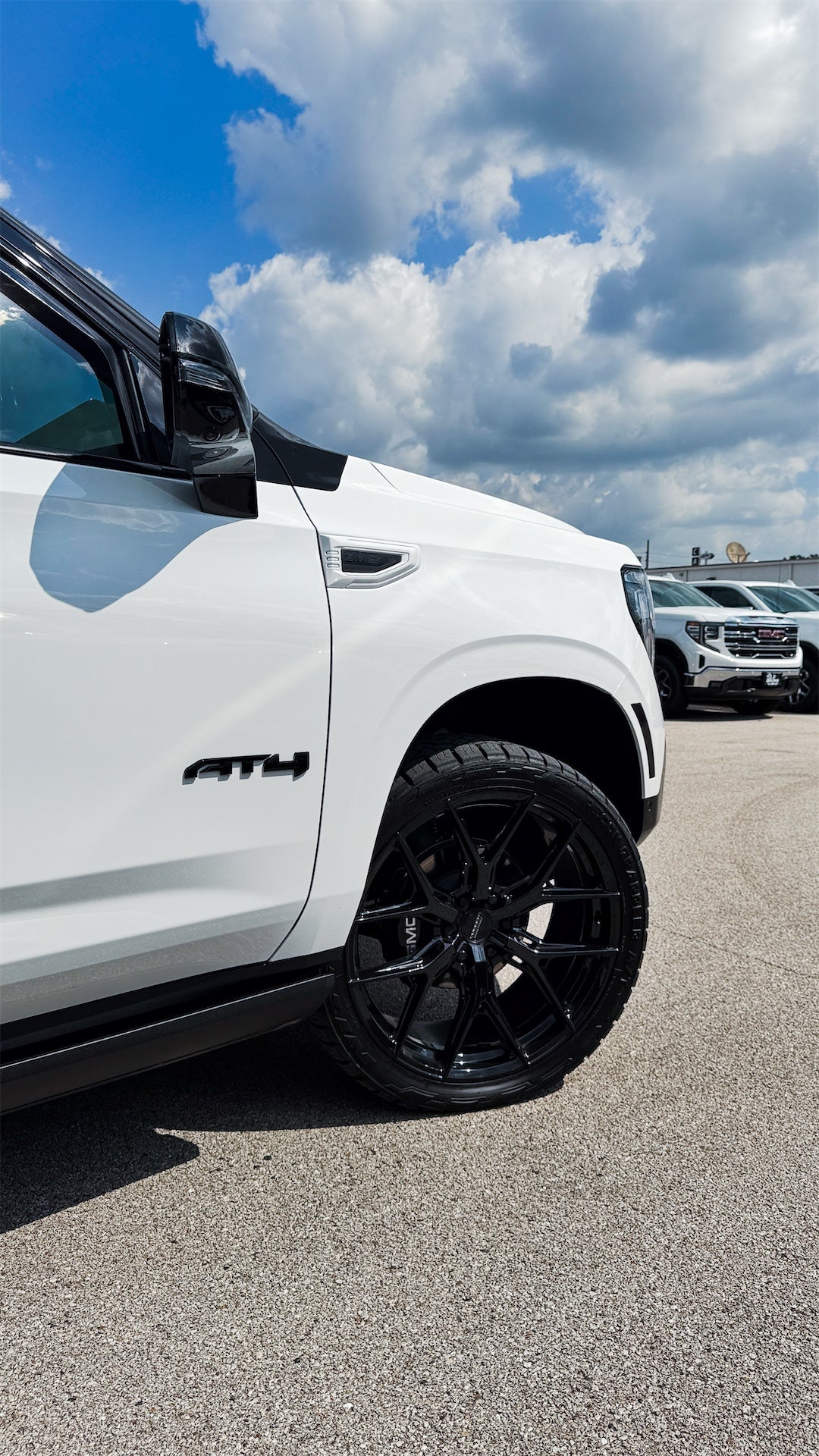 24-inch wheel and Nitto Recon Grappler tire on custom GMC Yukon AT4 Ultimate