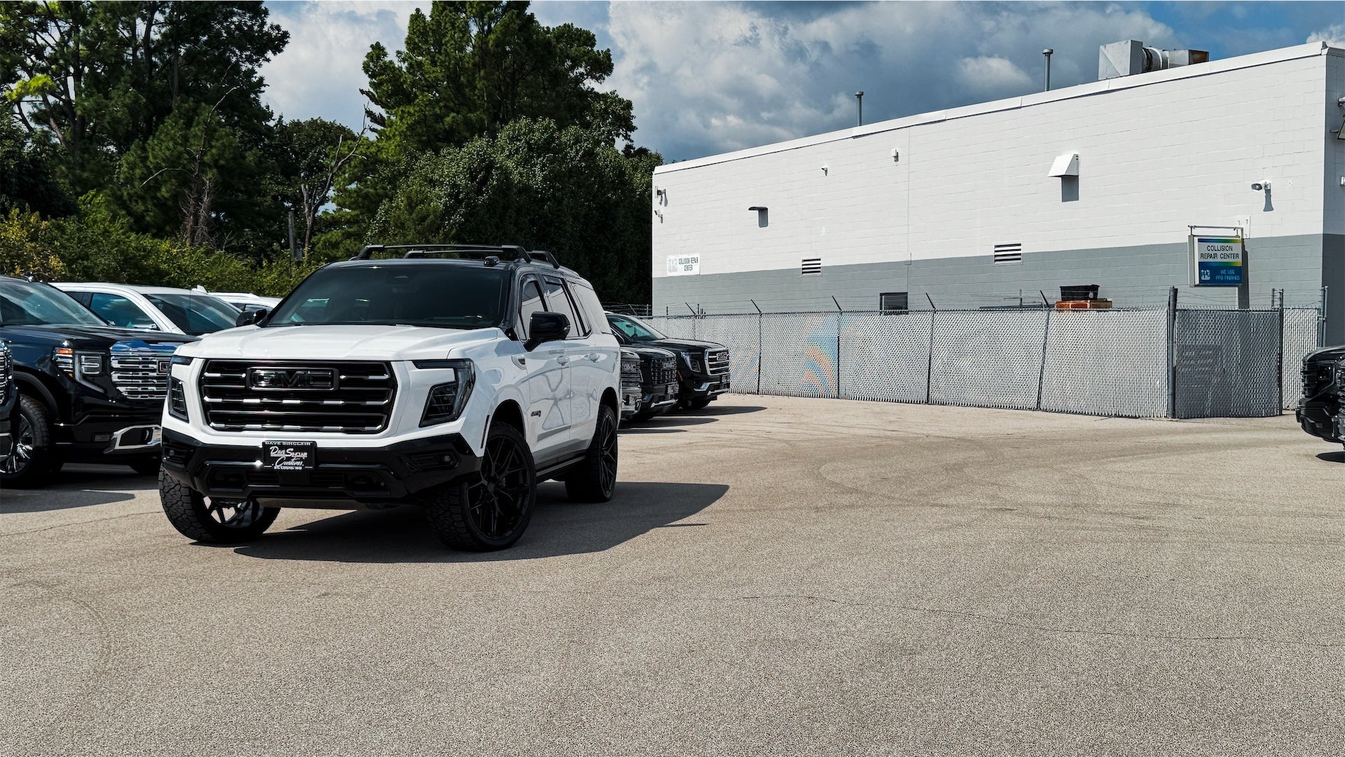 Custom 2026 GMC Yukon AT4 Ultimate with Summit White exterior and black vinyl two-tone roof